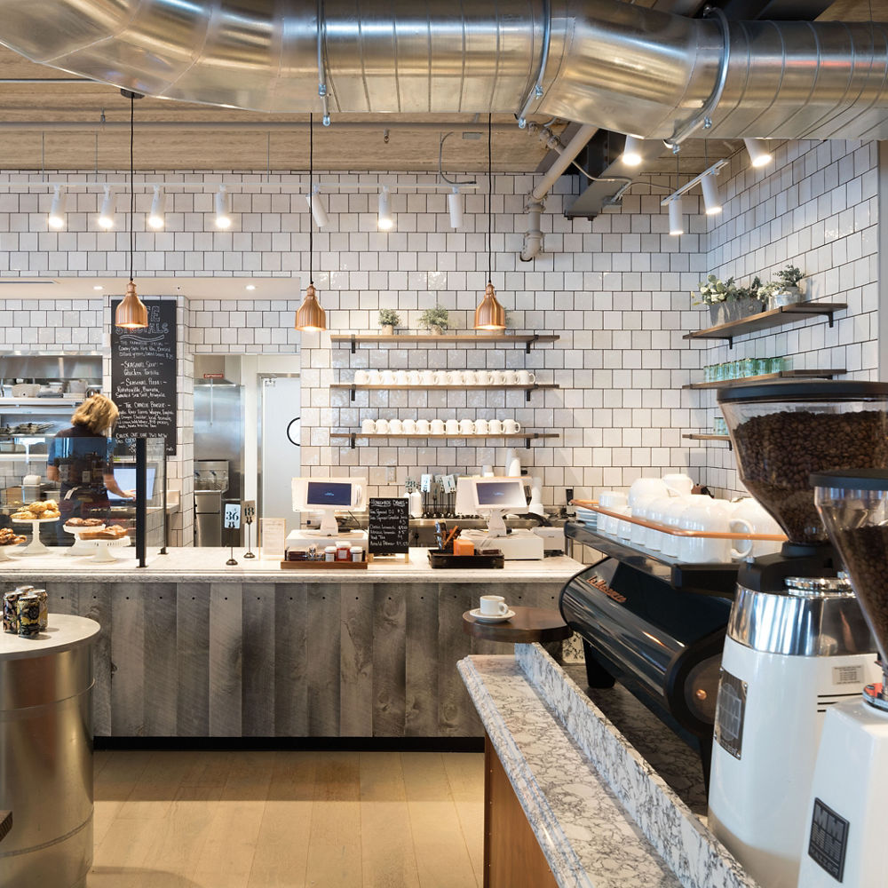 The Grocher's table bakery with shelving and countertops topped with Cambria quartz.