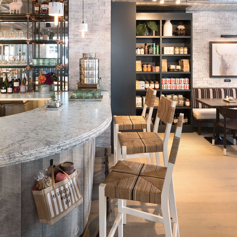 a bar at the Grocher's Table topped with Cambria quartz. 