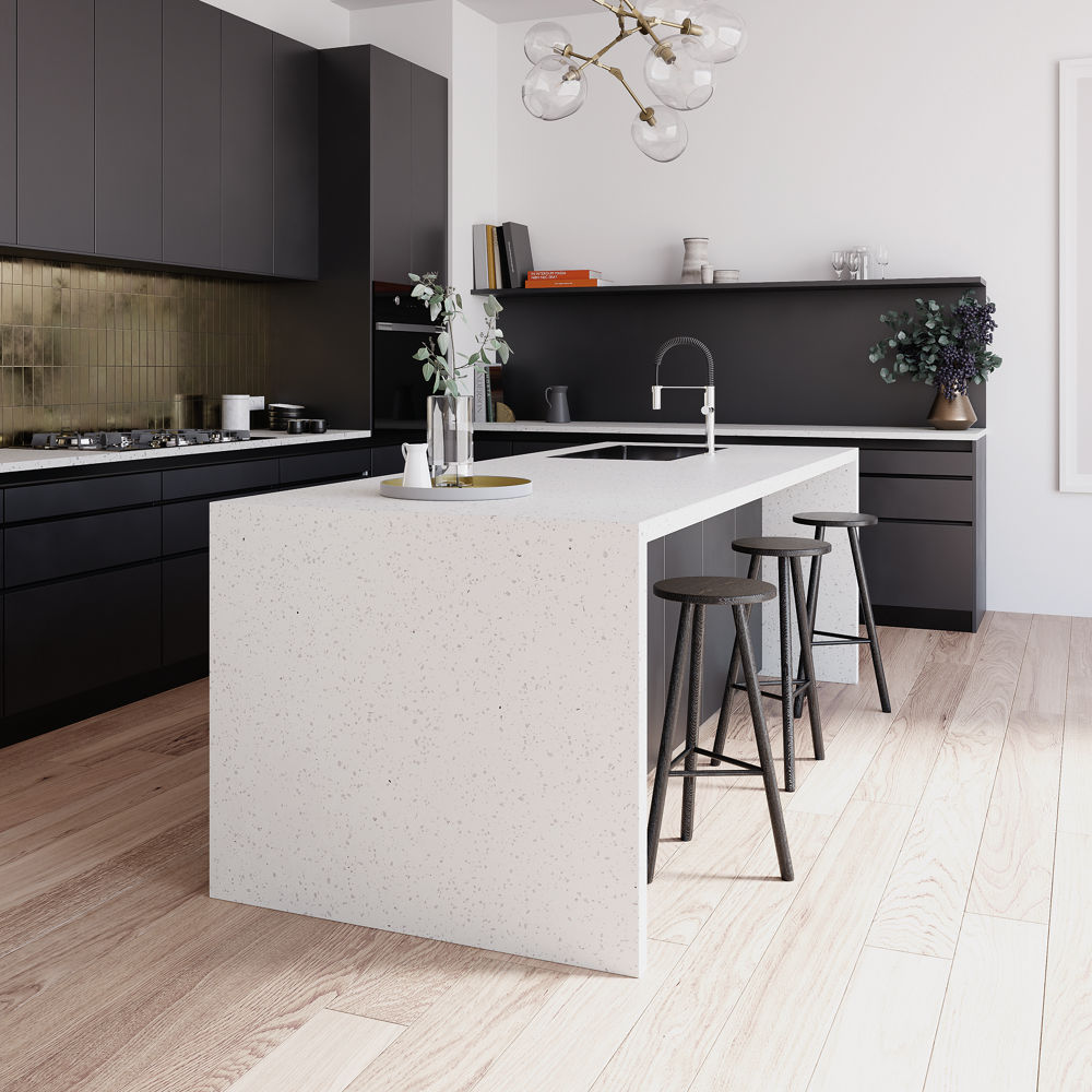 A kitchen with dark wood cabinets and Cambria Quartz Brittanicca waterfall edge kitchen island countertop and matching backsplash.