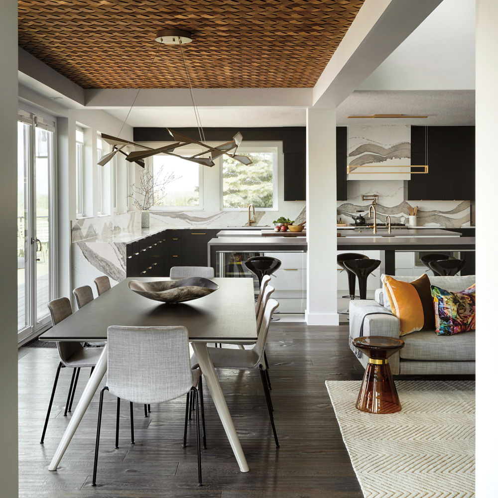 an open-concept layout with a dining table, gorgeous kitchen, and living room. 