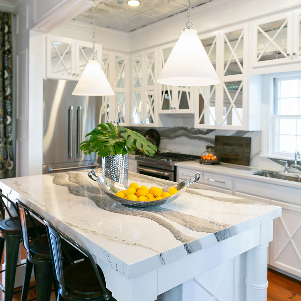 Jewel-box kitchen with Skara Brae countertops and backsplash.