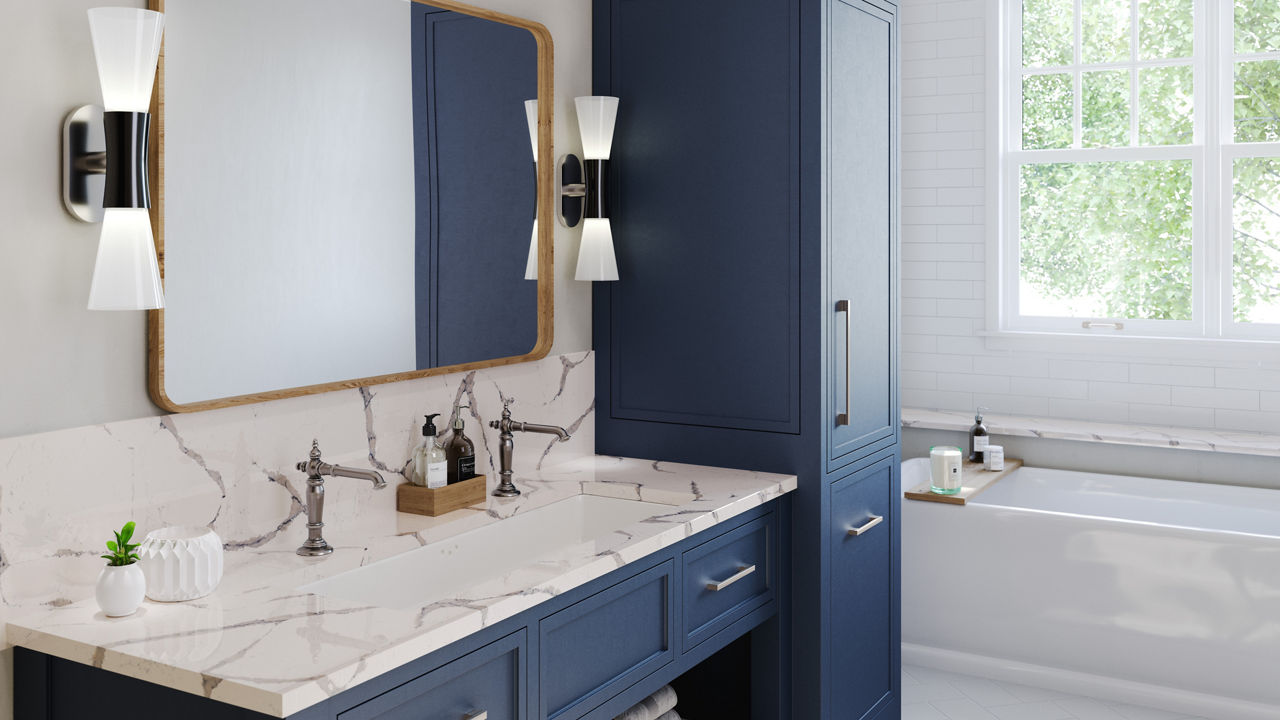 Summerbrook quartz countertops in a bathroom with blue cabinets 