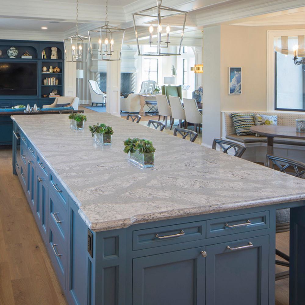 Open kitchen, dining, and living area with Summerhill quartz island kitchen countertops