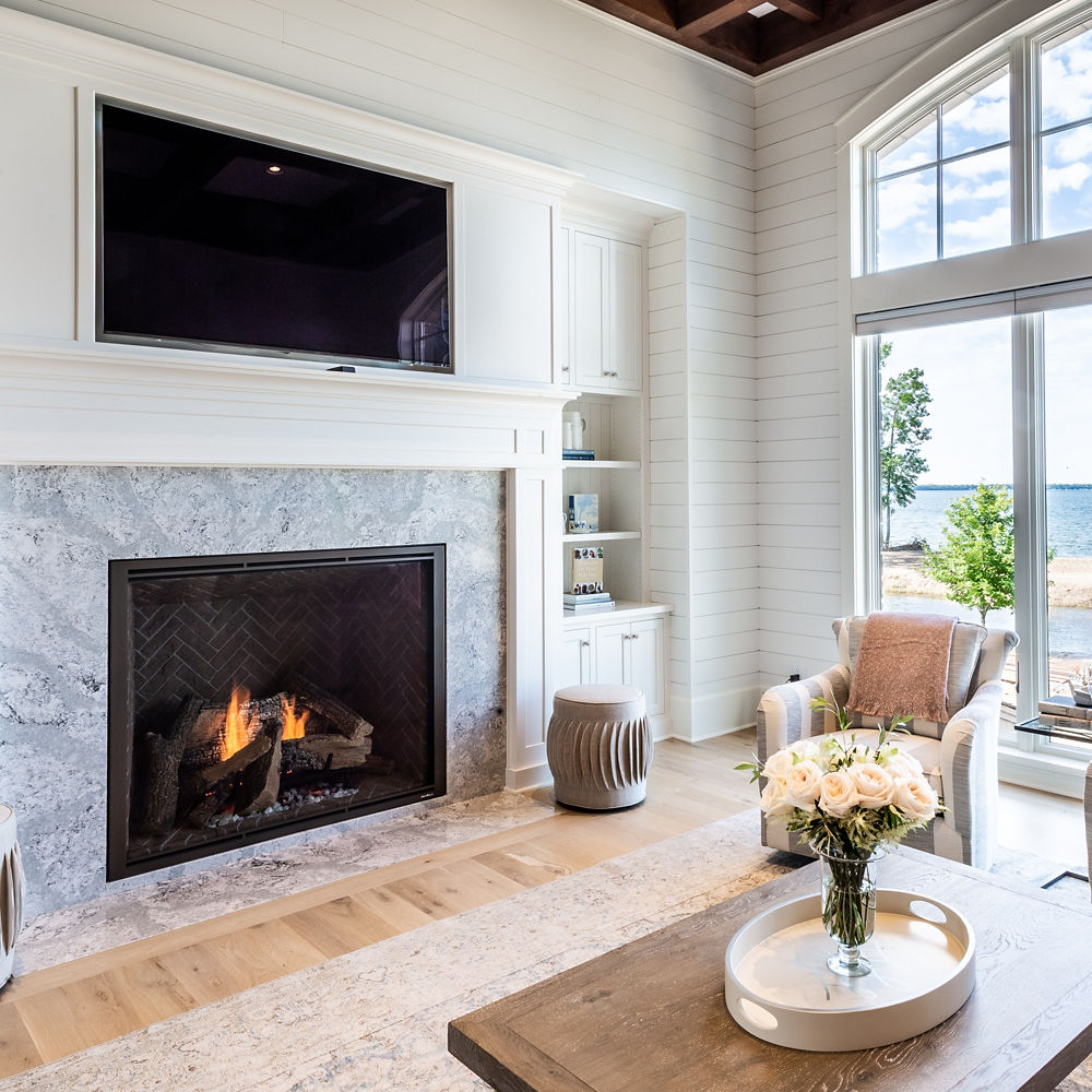 Coastal living room with a beach view and a Summerhill quartz fireplace surround