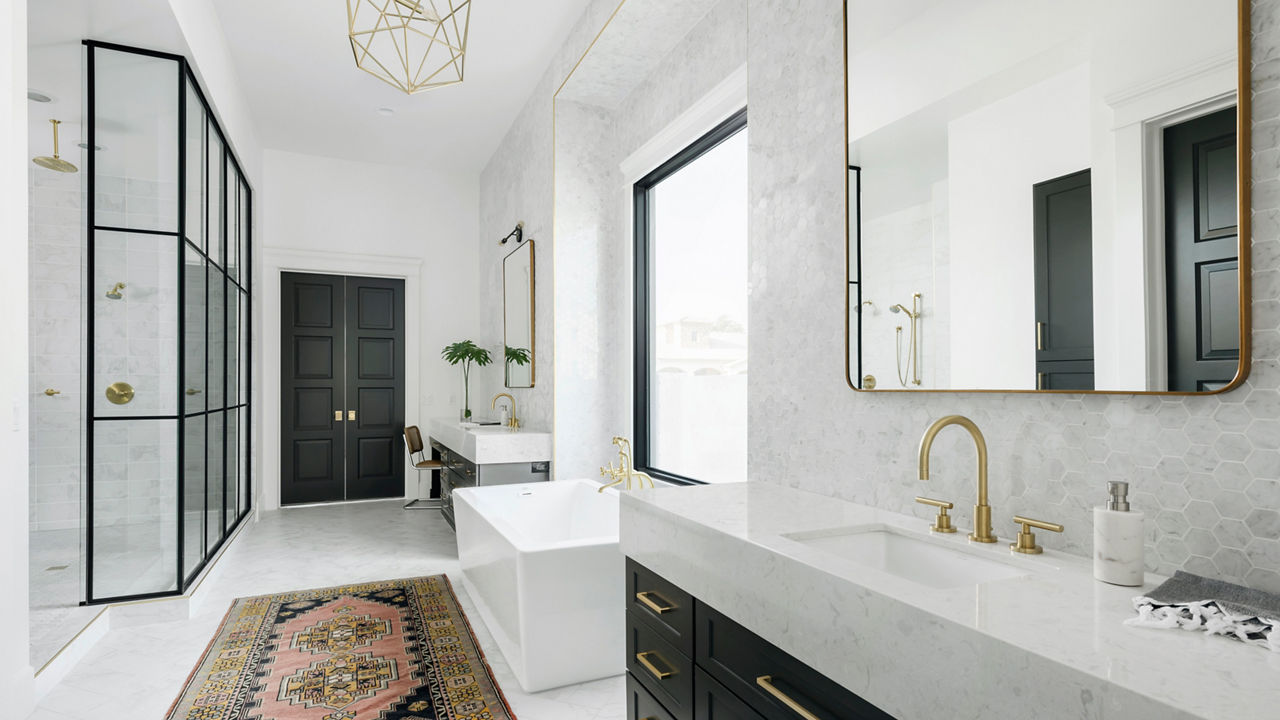 A master bathroom with dual Cambria Swanbridge quartz vanities.