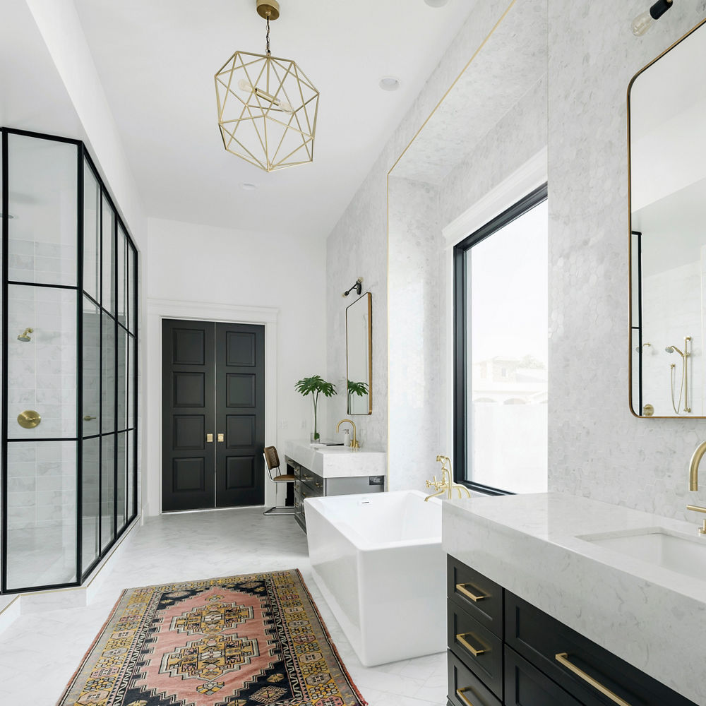 A master bathroom with dual Cambria Swanbridge quartz vanities.
