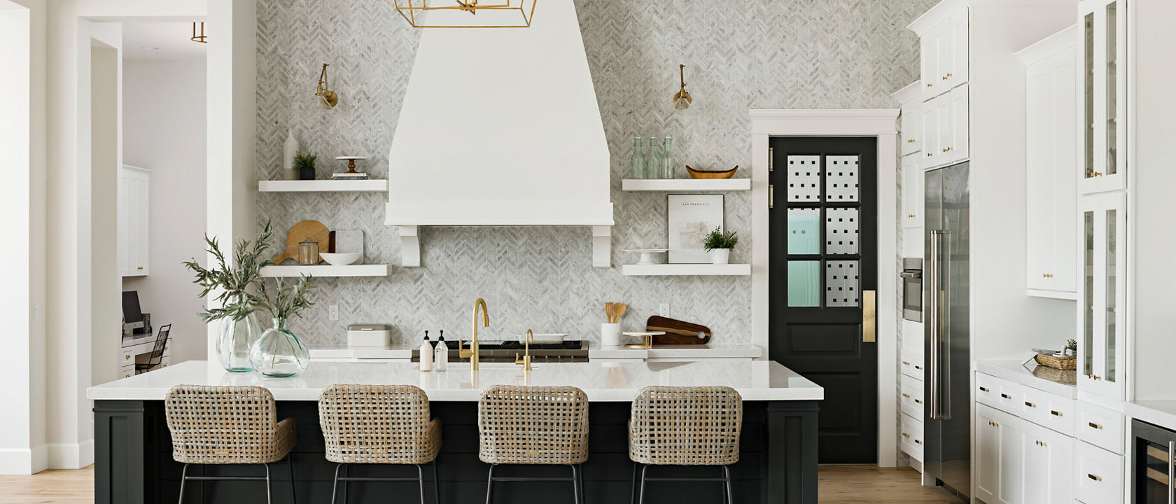 Bright white kitchen with a title wall backsplash and Swanbridge quartz countertops