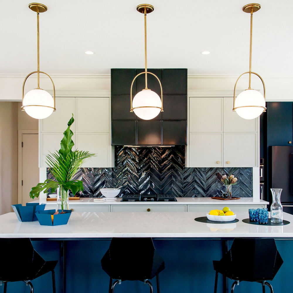 Blue, black, and white kitchen featuring Swanbridge from Haven Builders.