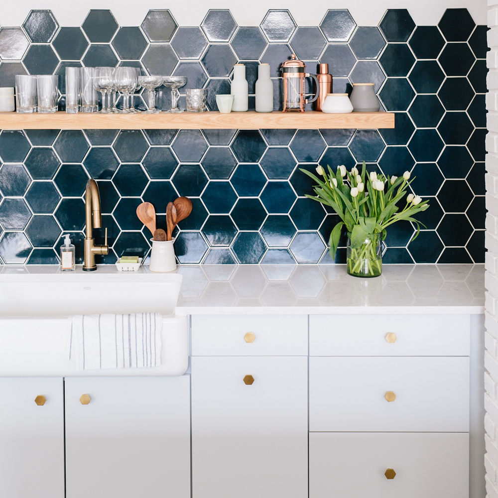 Cambria Swanbridge countertop with mosaic tile backsplash and farmhouse sink