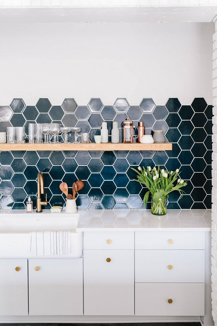 Cambria Swanbridge countertop with mosaic tile backsplash and farmhouse sink