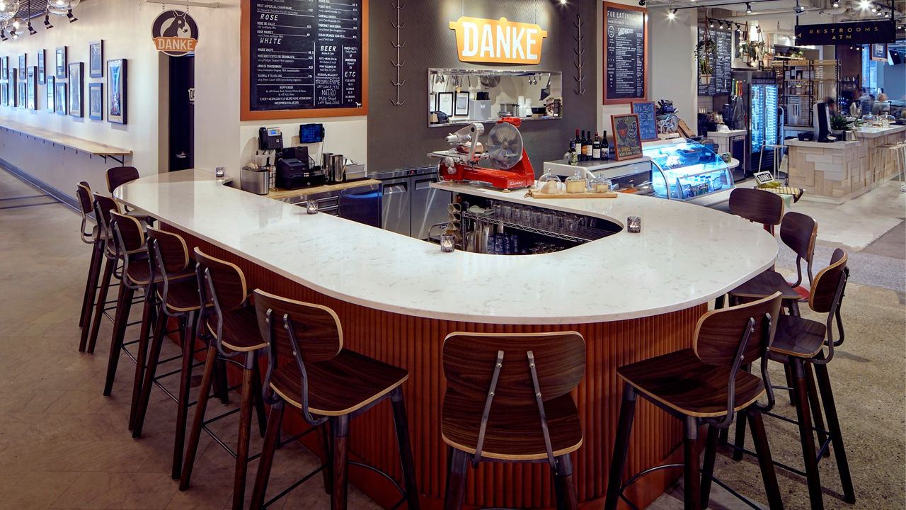 A rounded bar with a Cambria Torquay quartz countertop.