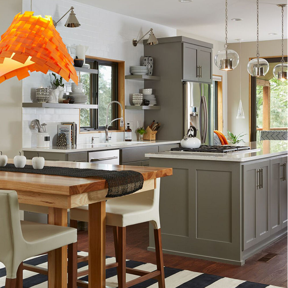 Kitchen with open-shelving and autumn colors mixed with the neutral Torquay quartz countertop.