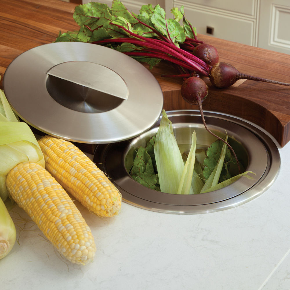 a stainless steel compost bin recessed into the island for easy, eco-friendly cleanup