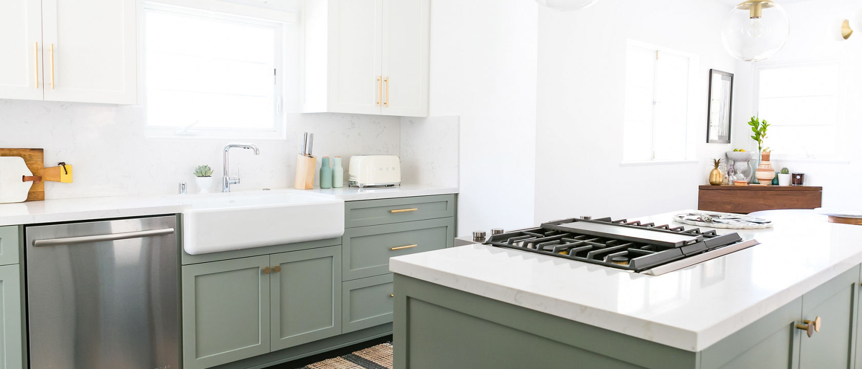 Torquay countertops in an olive kitchen theme with a farmhouse style sink