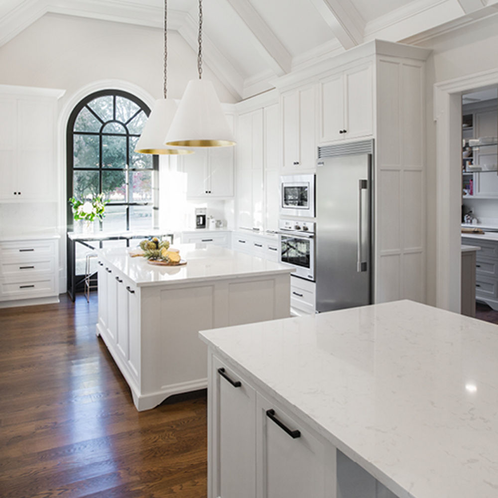 A farmhouse kitchen with a double island layout with Torquay quartz countertops