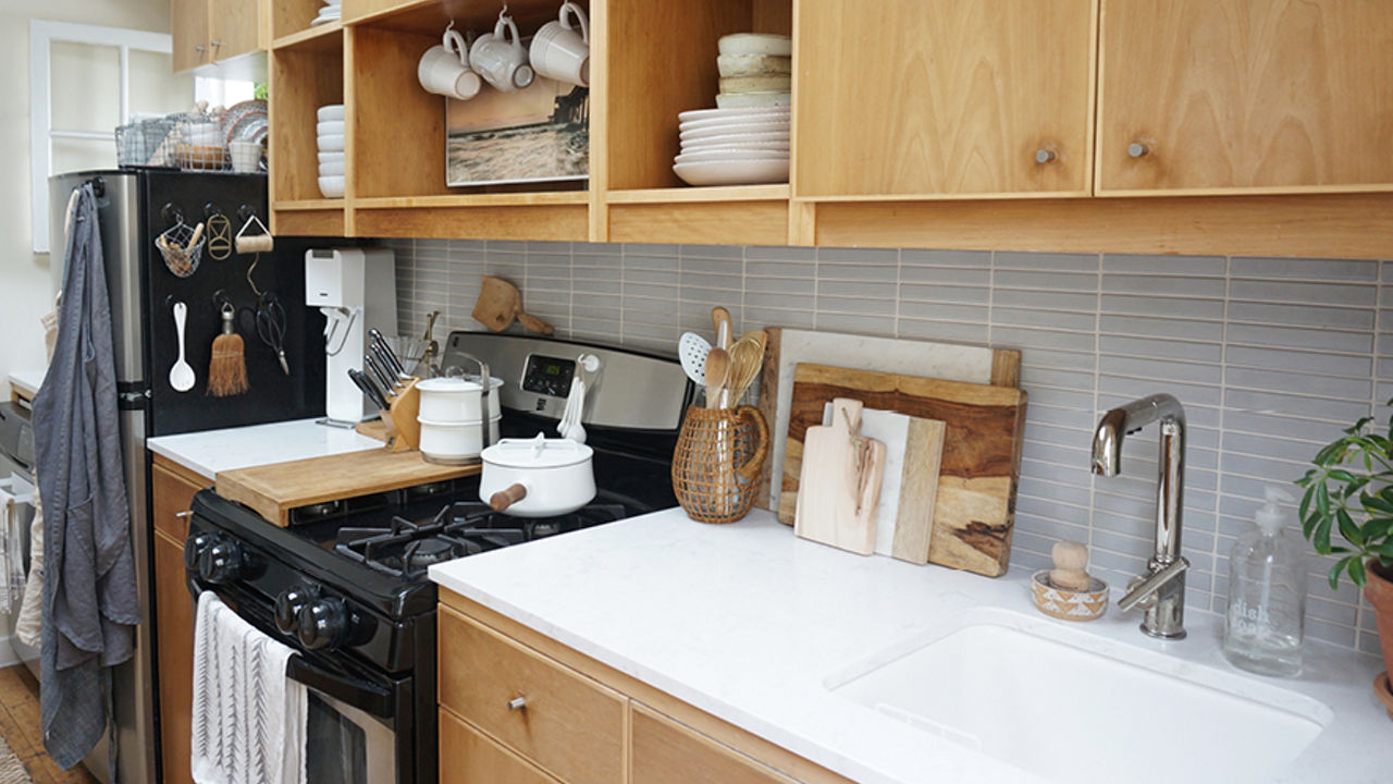 The Tiny Canal Cottage by Leigh Morris which features light wood countertops with Cambria Quartz Torquay countertops.