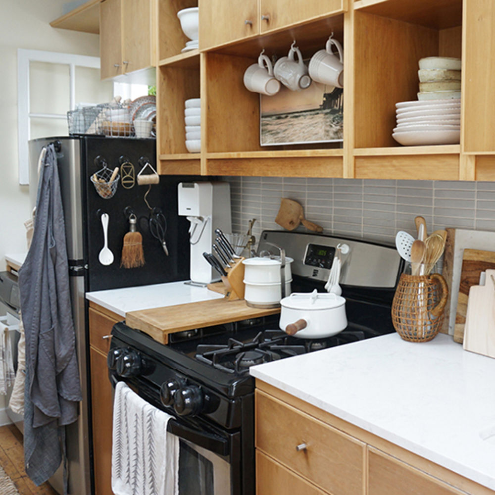 The Tiny Canal Cottage by Leigh Morris which features light wood countertops with Cambria Quartz Torquay countertops.