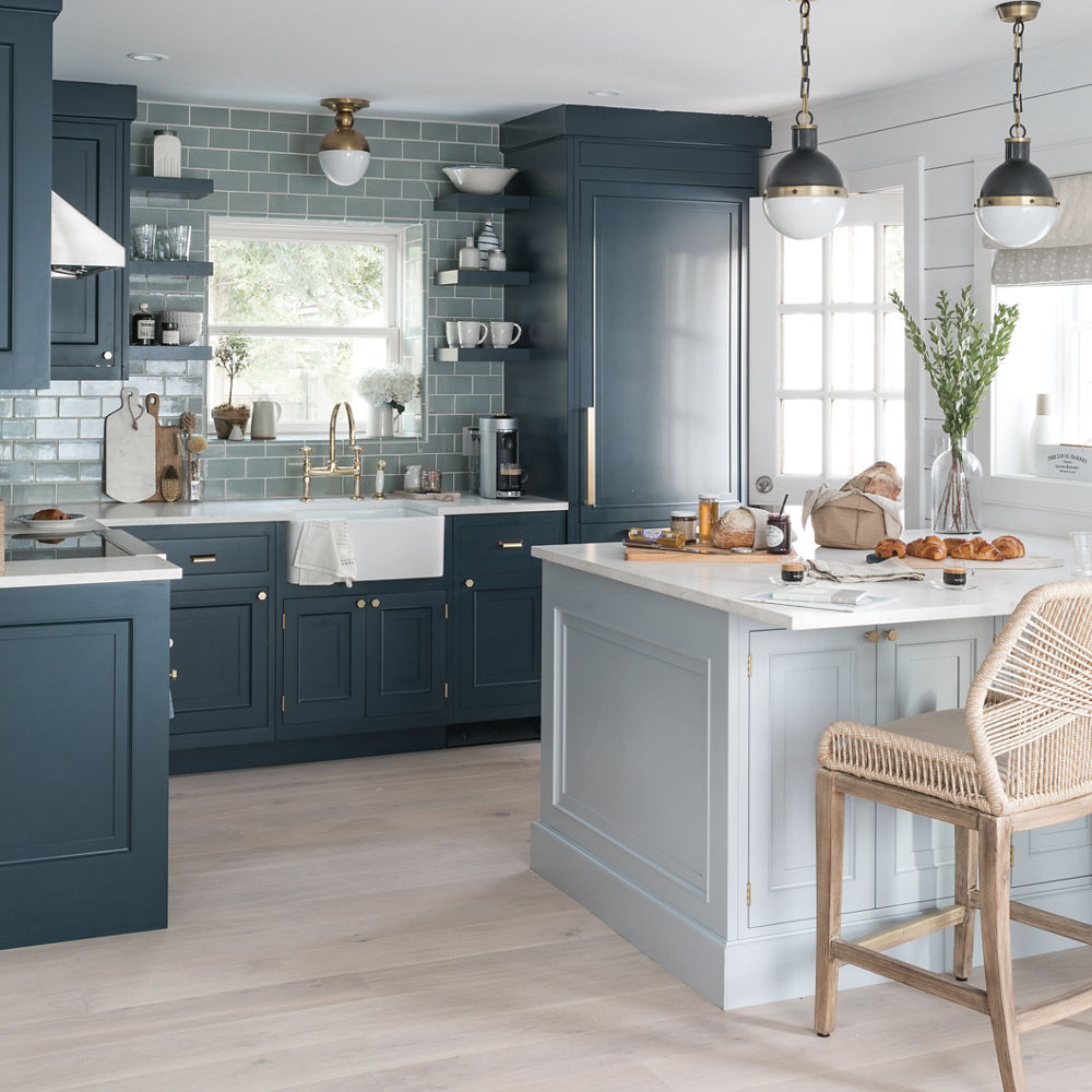 Photograph of navy and gray kitchen containing an island with a Torquay Matte countertop.