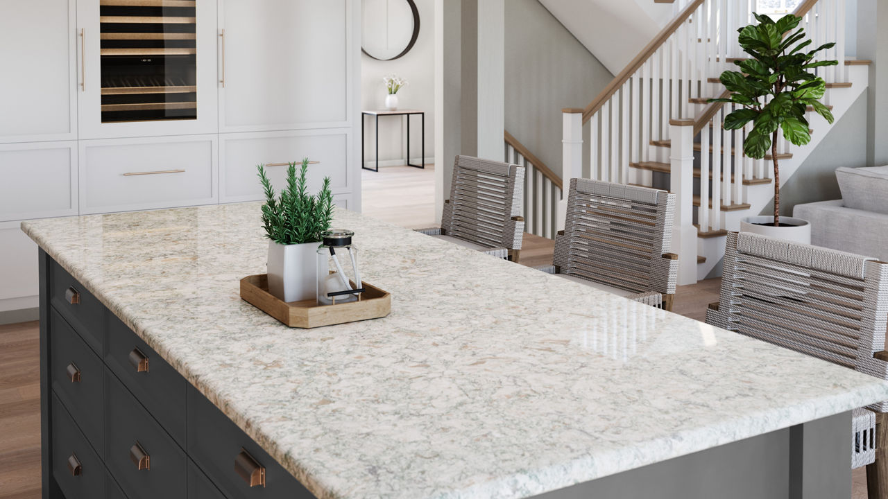 a kitchen with white walls, hardwood floors, a gray island topped with quartz countertops and two overhead pendant lights.