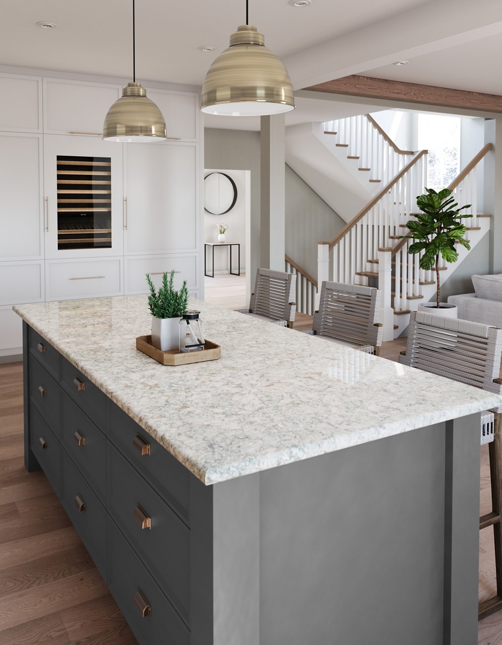 a kitchen with white walls, hardwood floors, a gray island topped with quartz countertops and two overhead pendant lights.