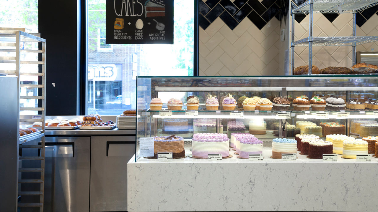 A bakery display at Whole Foods Market with a siding featuring Cambria Waverton quartz.