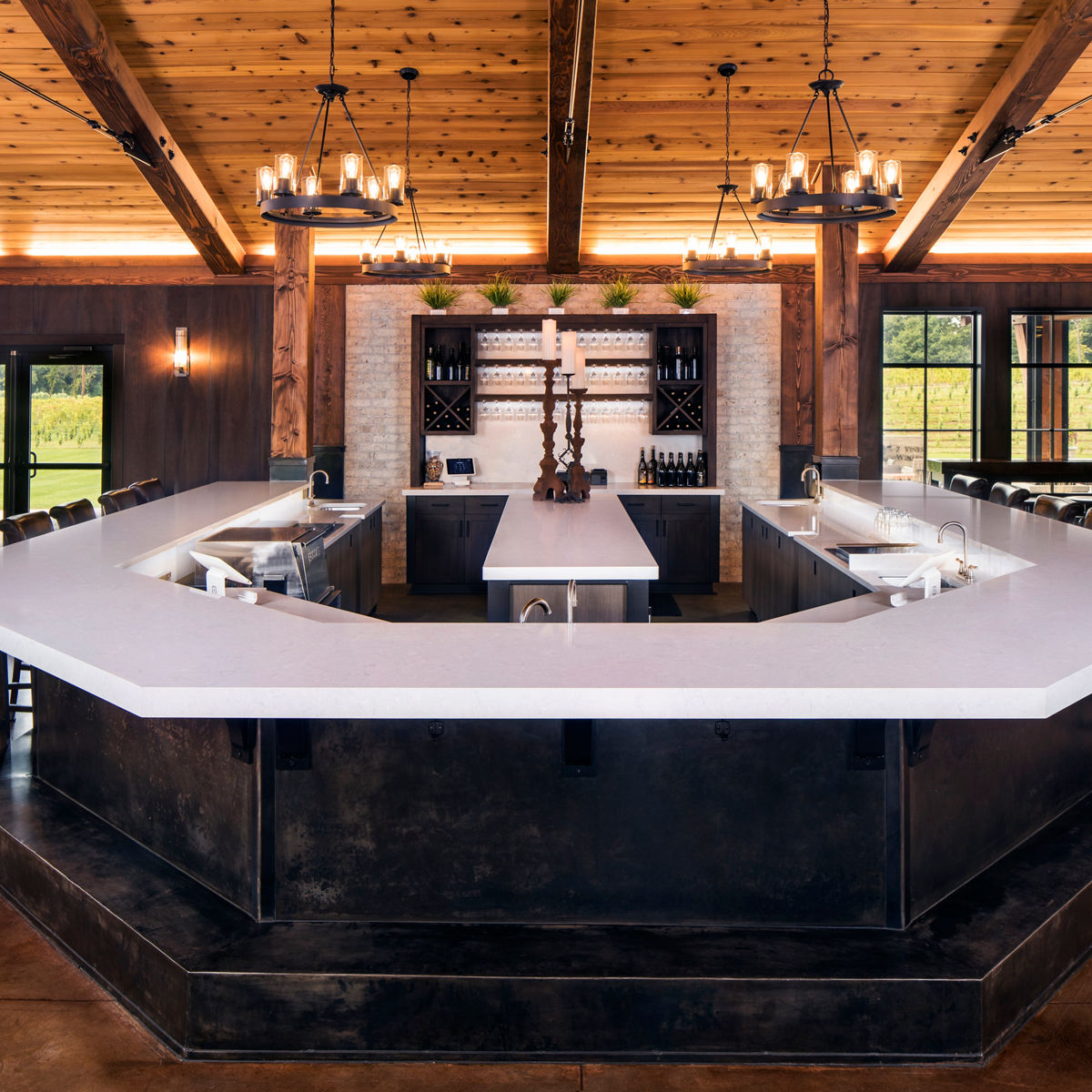 A bar at a winery and vineyard featuring Weybourne quartz countertops