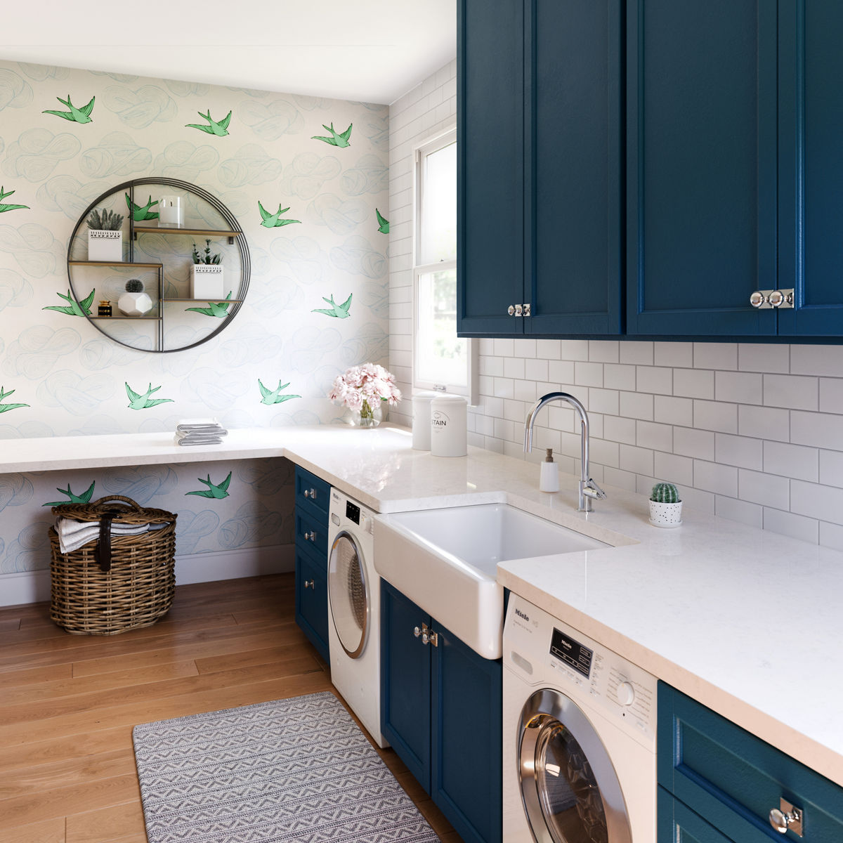A blue and white styled laundry room with Cambria Whitby quartz countertops and a farmhouse sink