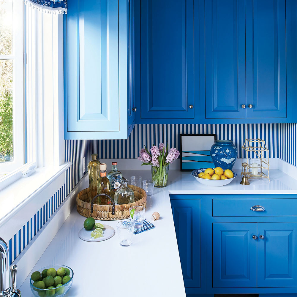 Transitional White Kitchen With Light Blue Cabinets and Brass