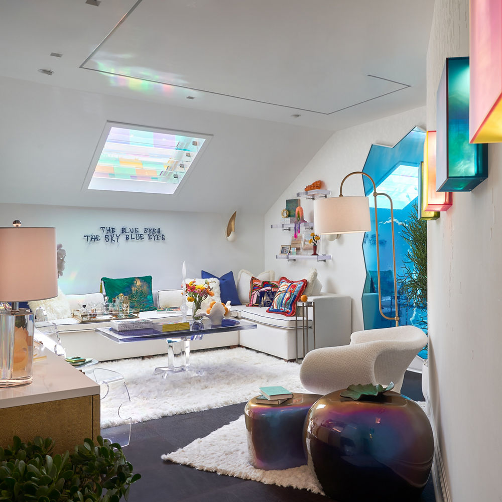 a living room with a media console topped with white quartz countertops.