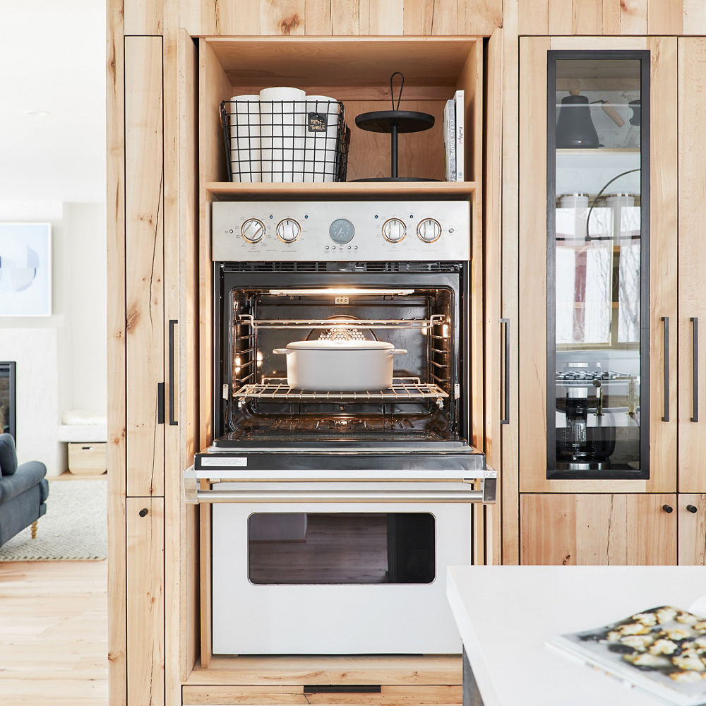 Custom storage solutions help hide appliances and keep countertops free from clutter.