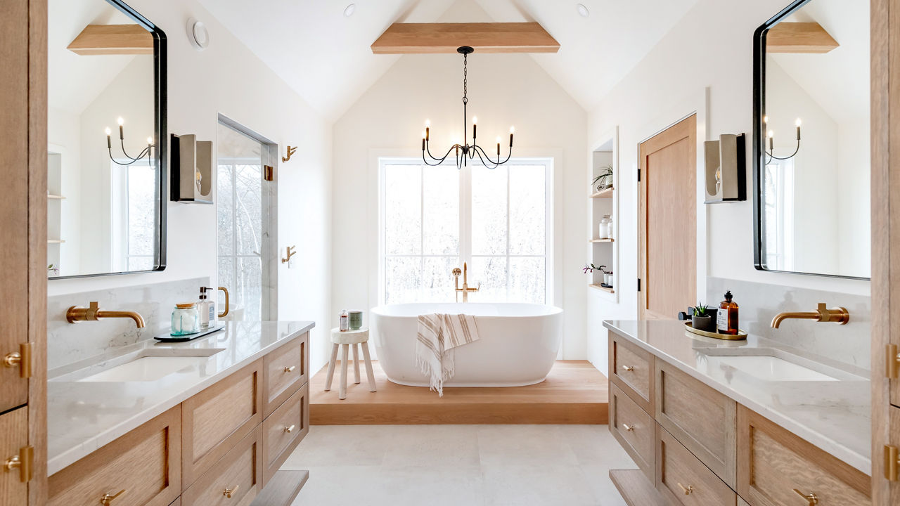 Bathroom with two countertops, both featuring Cambria Windrush quartz countertops.