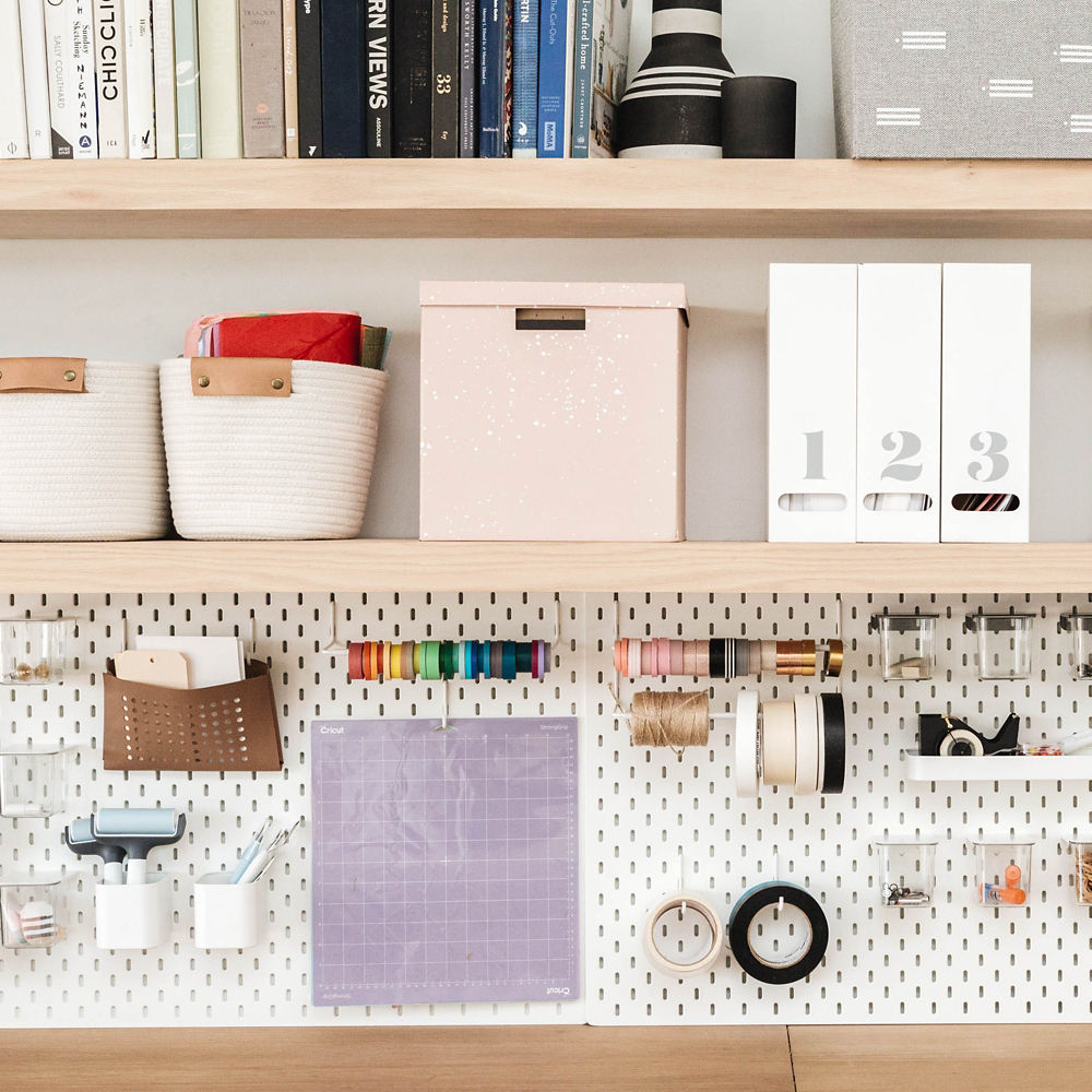 workspace shelving for ribbon, scissors, tape, pins, and papers. 