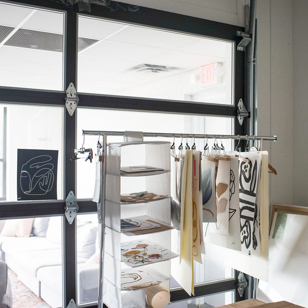 An interior workspace gives a nod to the building’s heritage while allowing in natural light for an open, airy feel due to the addition of garage doors to the